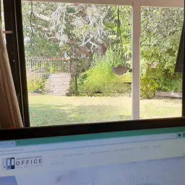 From my desk, view of my laptop as a remote worker