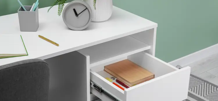 White office desk drawers open with stationery