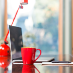 Red mug and lamp on desk psychology of color